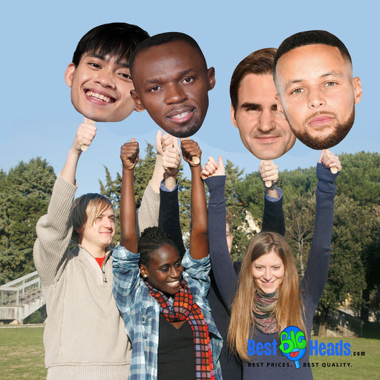 Group of cousins laughing and enjoying a reunion, posing for a playful photo shoot while holding a Best BIG Head face cutout of their other cousin.