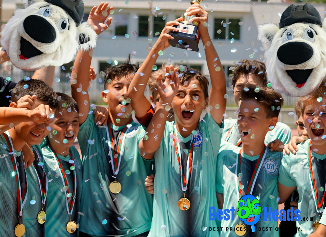 A vibrant awarding ceremony featuring a sports team celebrating their victory by waving oversized face cutouts of their team mascot. 