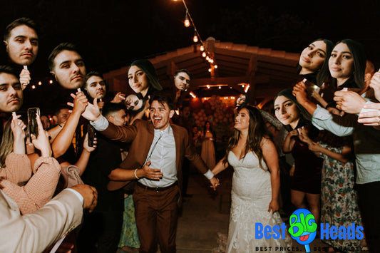 A joyful celebration of the newlyweds' after-party, surrounded by loved ones and family members holding playful face cutouts of the couple.