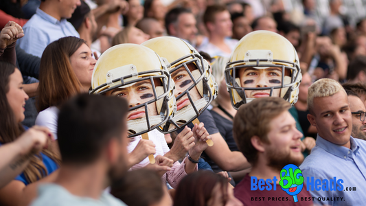 A proud family member shows support for their child during the game by waving and displaying a face cutout, boosting the player's morale and confidence.